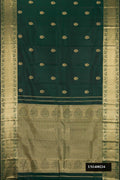 Bottle Green Dual Tone Kanchipuram Silk Saree with Zari Butta on the body and Zari Border.  displayed on a mannequin