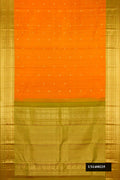 Mustard Dual Tone Kanchipuram Silk Saree with Zari Butta on the body and Zari Border.  displayed on a mannequin