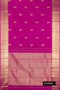 Magenta Dual Tone Kanchipuram Silk Saree with Zari Butta on the body and Zari Border.  displayed on a mannequin