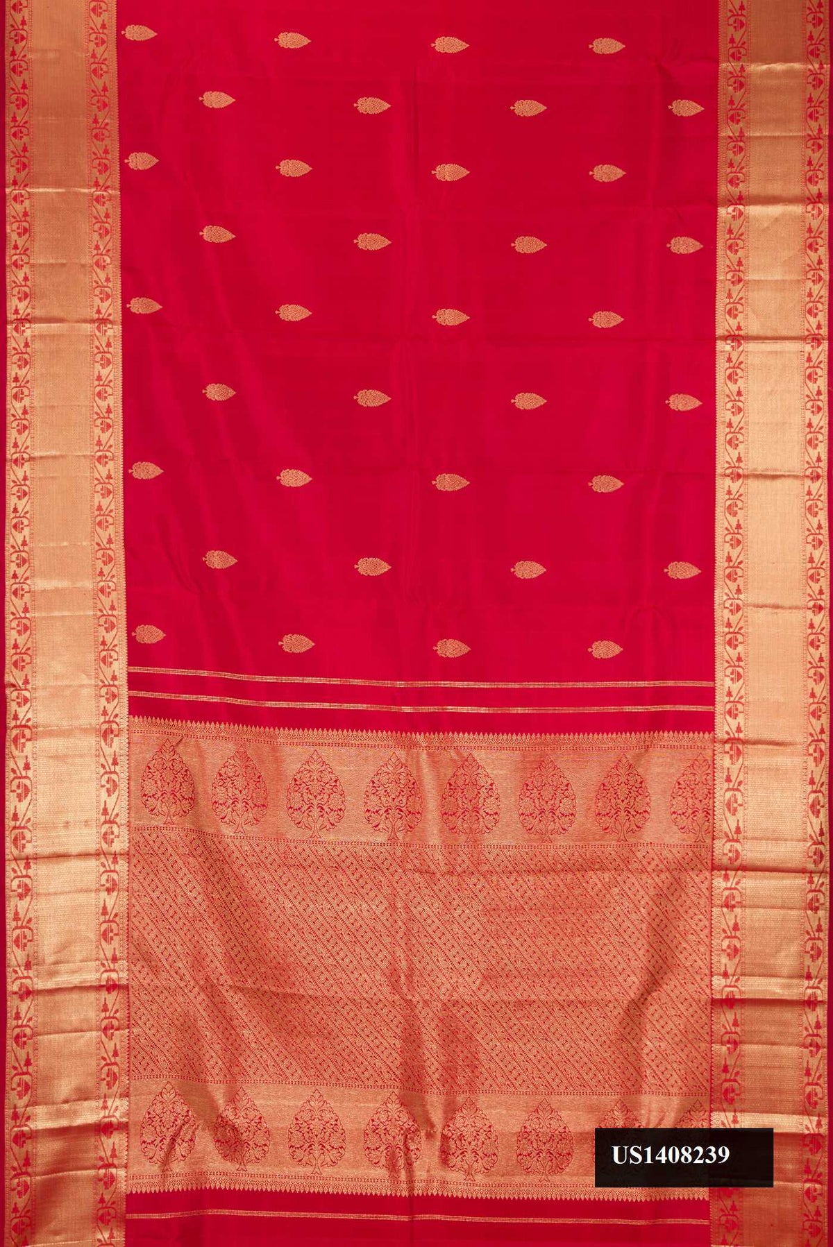 Maroon Dual Tone Kanchipuram Silk Saree with Zari Butta on the body and Zari Border.  displayed on a mannequin