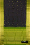 Black Dual Tone Kanchipuram Silk Saree with Zari Butta on the body and Zari Border.  displayed on a mannequin