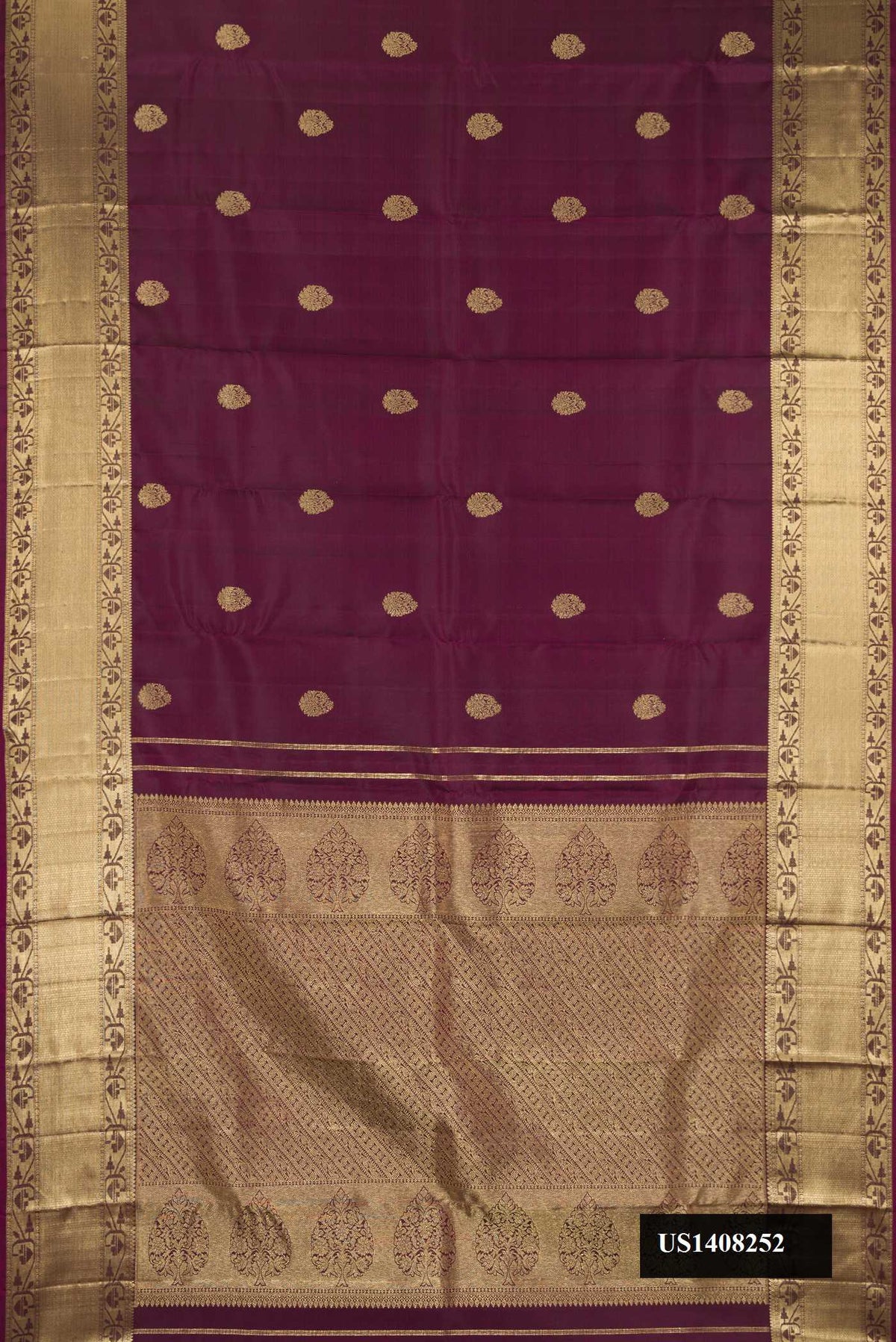 Burgundy Dual Tone Kanchipuram Silk Saree with Zari Butta on the body and Zari Border.  displayed on a mannequin