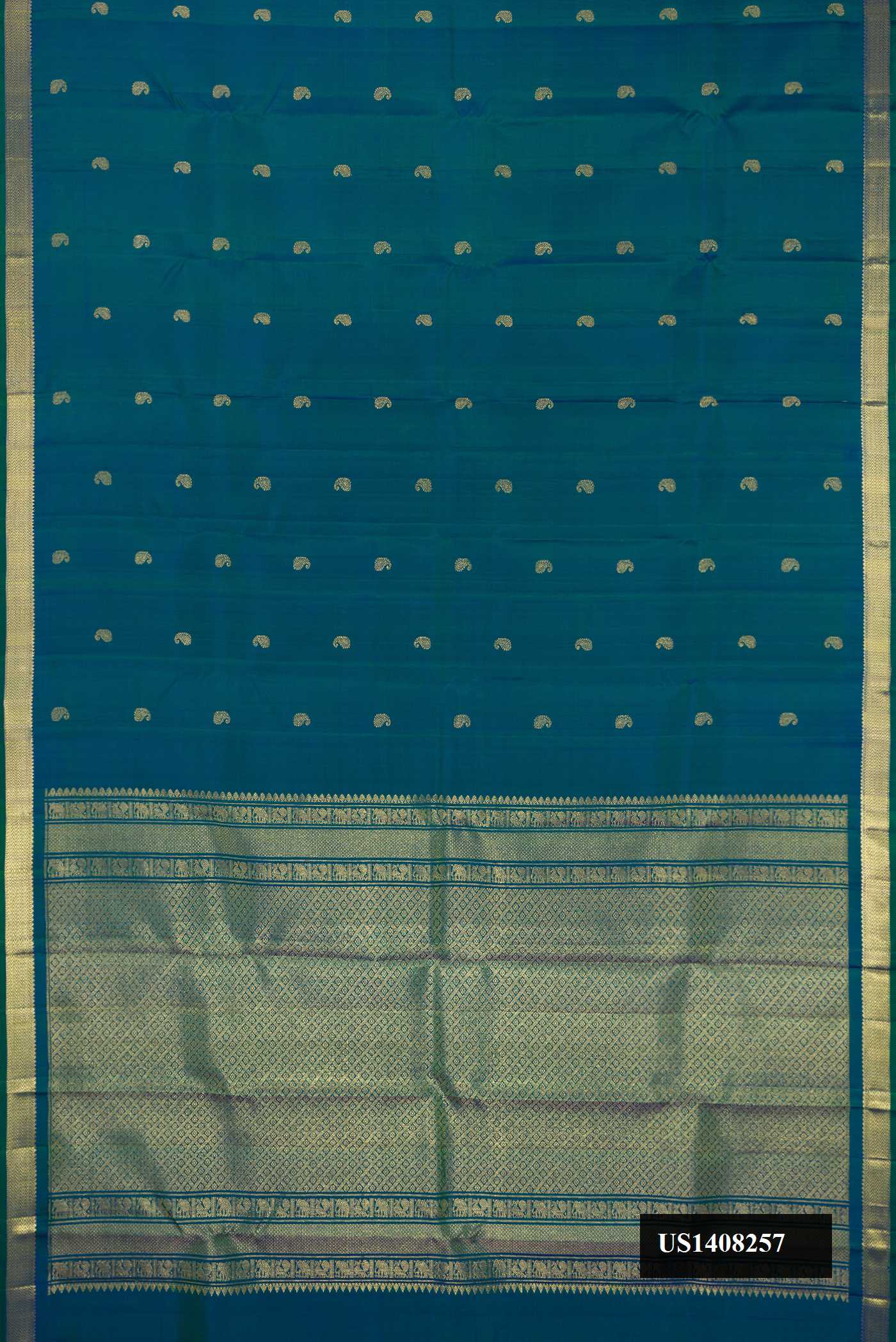 Peacock Blue Dual Tone Kanchipuram Silk Saree with Zari Butta on the body and Zari Border.  displayed on a mannequin