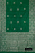 Green Dual Tone Kanchipuram Silk Saree with Zari Butta on the body and Zari Border.  displayed on a mannequin