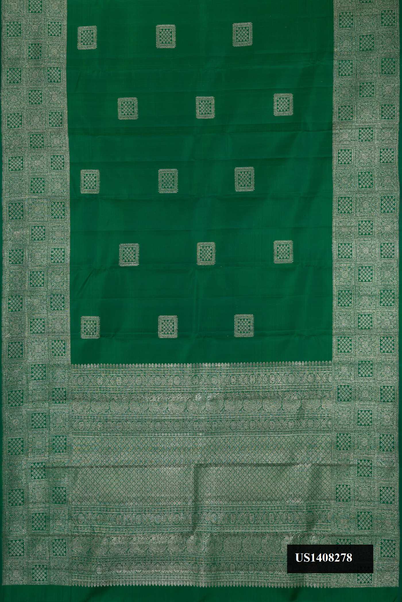 Green Dual Tone Kanchipuram Silk Saree with Zari Butta on the body and Zari Border.  displayed on a mannequin