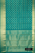 Green Dual Tone Kanchipuram Silk Saree with Zari Brocade on the body and Zari Border.  displayed on a mannequin