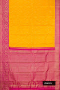 Yellow Dual Tone Kanchipuram Silk Saree with Zari Brocade on the body and Zari Border.  displayed on a mannequin