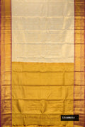 Gold Dual Tone Kanchipuram Tissue Silk Saree with Zari Brocade on the body and Zari Border.  displayed on a mannequin