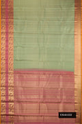 Pista Green Dual Tone Kanchipuram Silk Saree with Zari Brocade on the body and Fancy Border.  displayed on a mannequin