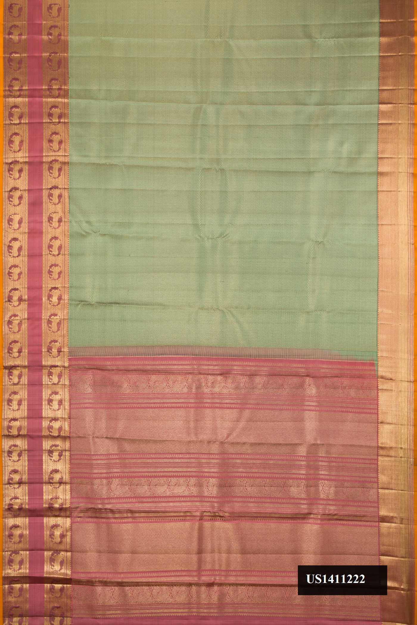 Pista Green Dual Tone Kanchipuram Silk Saree with Zari Brocade on the body and Fancy Border.  displayed on a mannequin