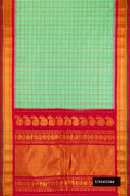 Pista Green Dual Tone Gadwal Silk Saree with Checked design on the body and Fancy Border.  displayed on a mannequin