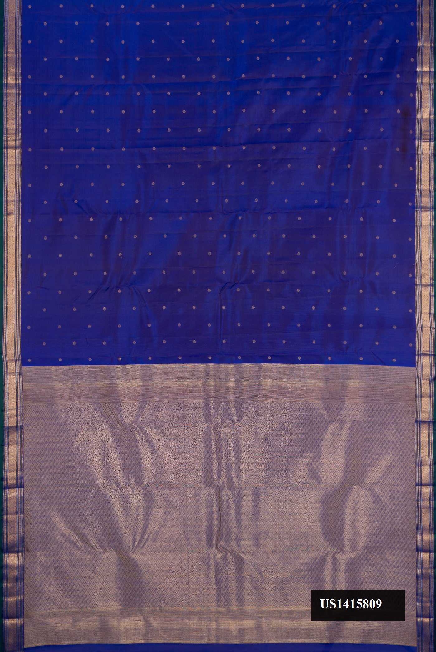Royal Blue Dual Tone Kanchipuram Silk Saree with Zari Butta on the body and Zari Border.  displayed on a mannequin
