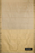 Beige Dual Tone Kanchipuram Silk Saree with Zari Butta on the body and Zari Border.  displayed on a mannequin