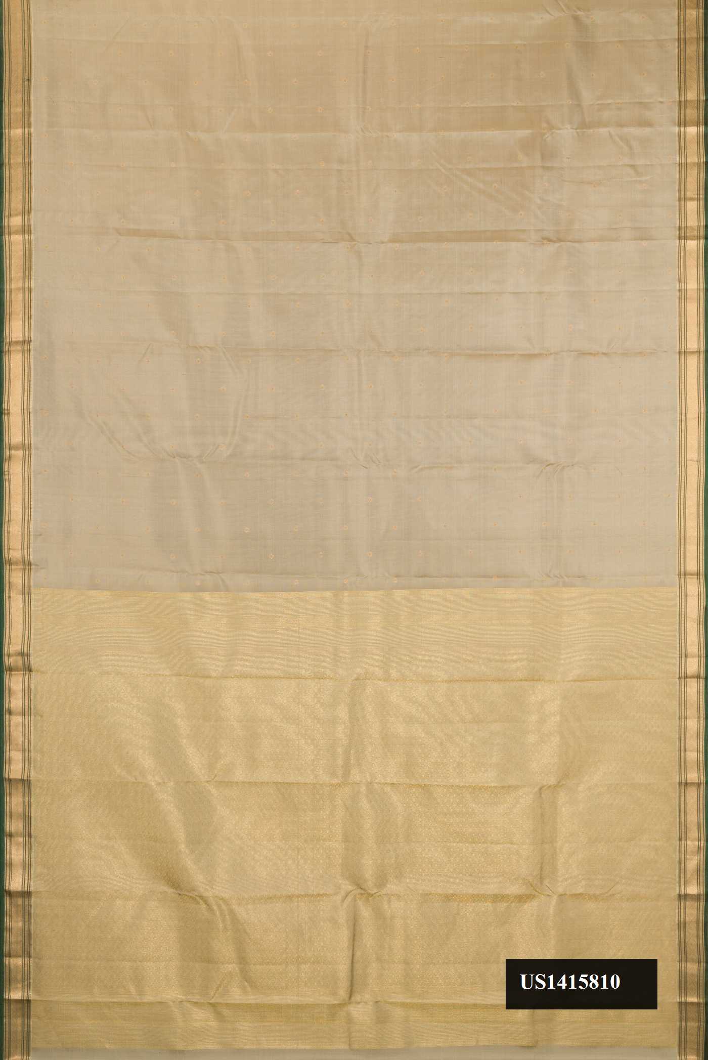 Beige Dual Tone Kanchipuram Silk Saree with Zari Butta on the body and Zari Border.  displayed on a mannequin