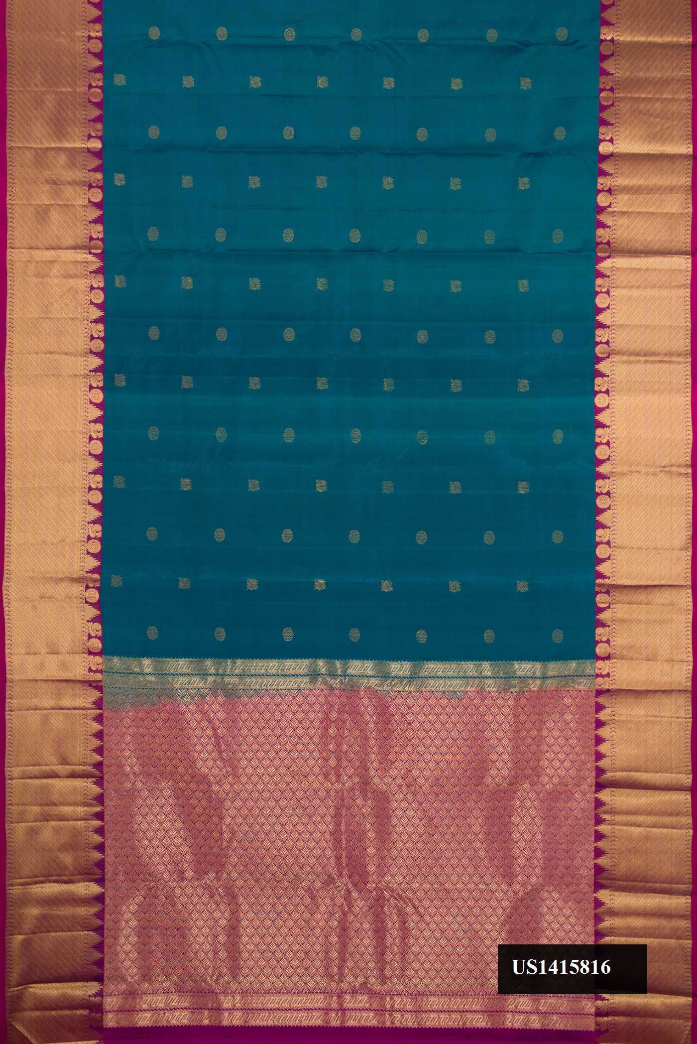 Peacock Blue Dual Tone Kanchipuram Silk Saree with Zari Butta on the body and Zari Border.  displayed on a mannequin