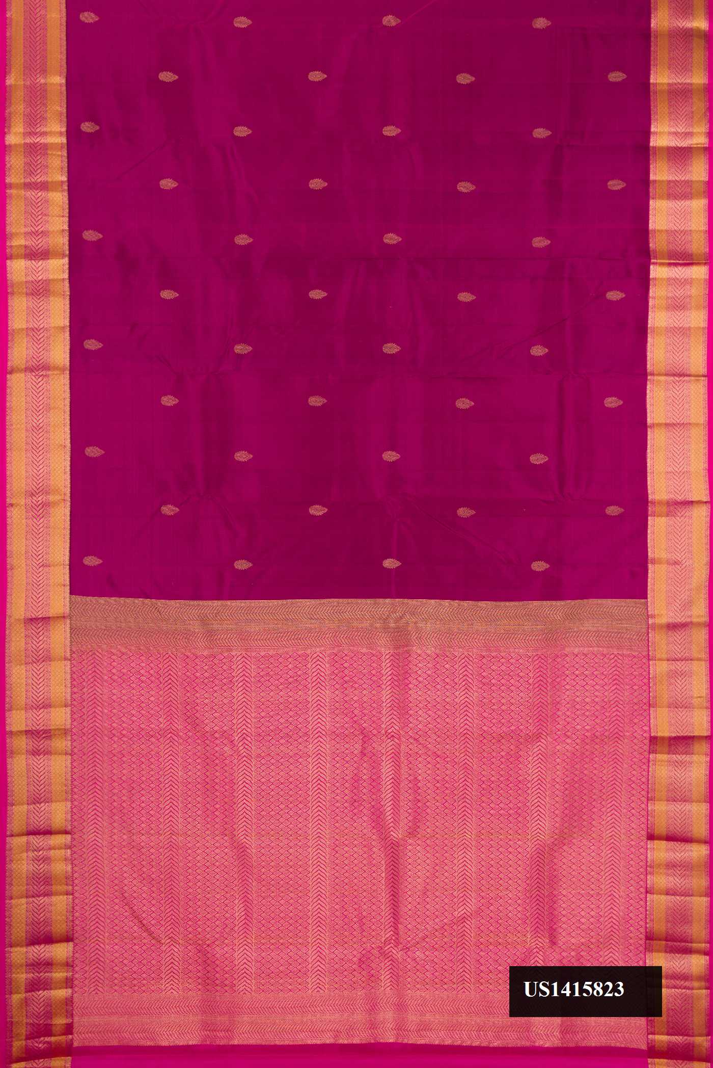 Magenta Dual Tone Kanchipuram Silk Saree with Zari Butta on the body and Zari Border.  displayed on a mannequin