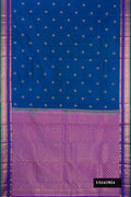 Peacock Blue Dual Tone Kanchipuram Silk Saree with Zari Butta on the body and Zari Border.  displayed on a mannequin