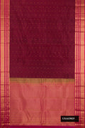 Maroon Dual Tone Kanchipuram Silk Saree with Zari Butta on the body and Zari Border.  displayed on a mannequin