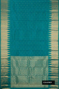 Green Dual Tone Kanchipuram Silk Saree with Zari Butta on the body and Fancy Border.  displayed on a mannequin