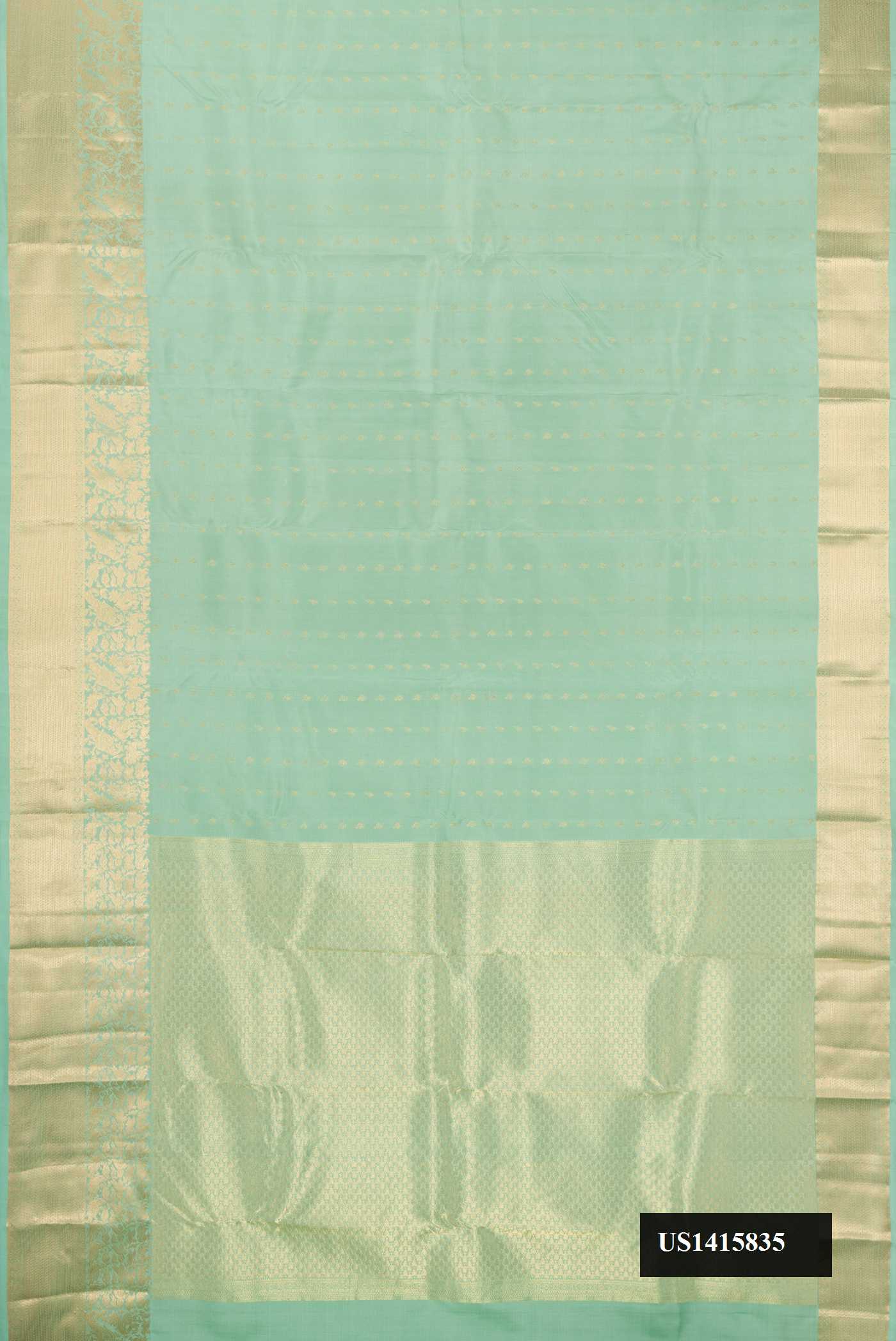 Pista Green Dual Tone Kanchipuram Silk Saree with Zari Butta on the body and Zari Border.  displayed on a mannequin