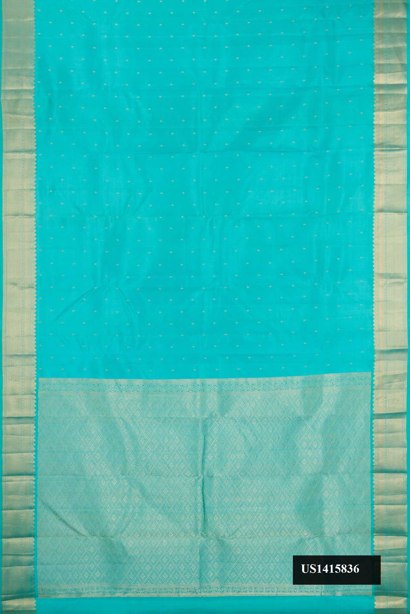 Sky Blue Dual Tone Kanchipuram Silk Saree with Zari Butta on the body and Zari Border.  displayed on a mannequin