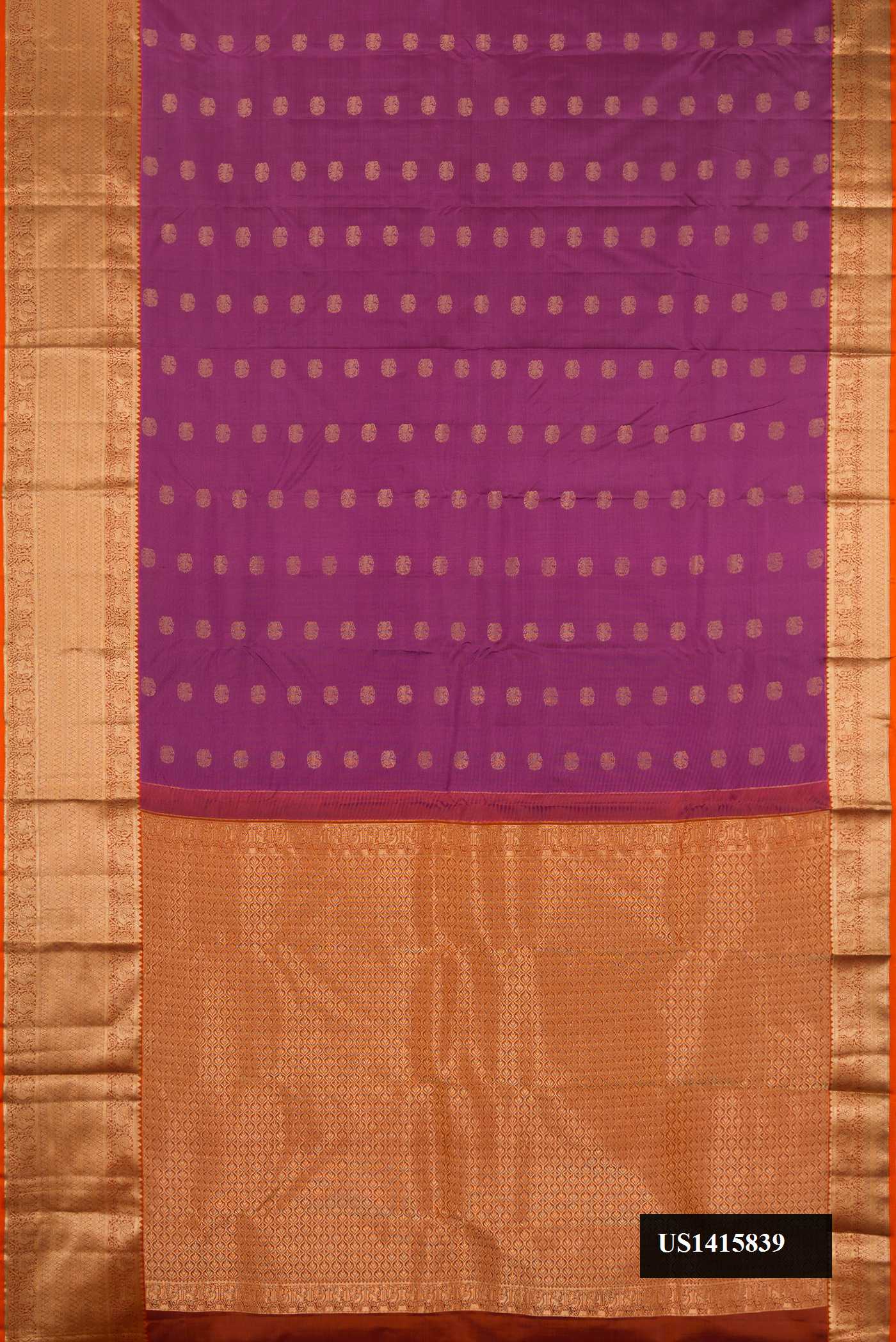 Dark Mauve Dual Tone Kanchipuram Silk Saree with Zari Butta on the body and Zari Border.  displayed on a mannequin