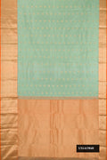 Pista Green Dual Tone Kanchipuram Silk Saree with Zari Butta on the body and Zari Border.  displayed on a mannequin