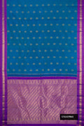 Peacock Blue Dual Tone Kanchipuram Silk Saree with Zari Butta on the body and Zari Border.  displayed on a mannequin