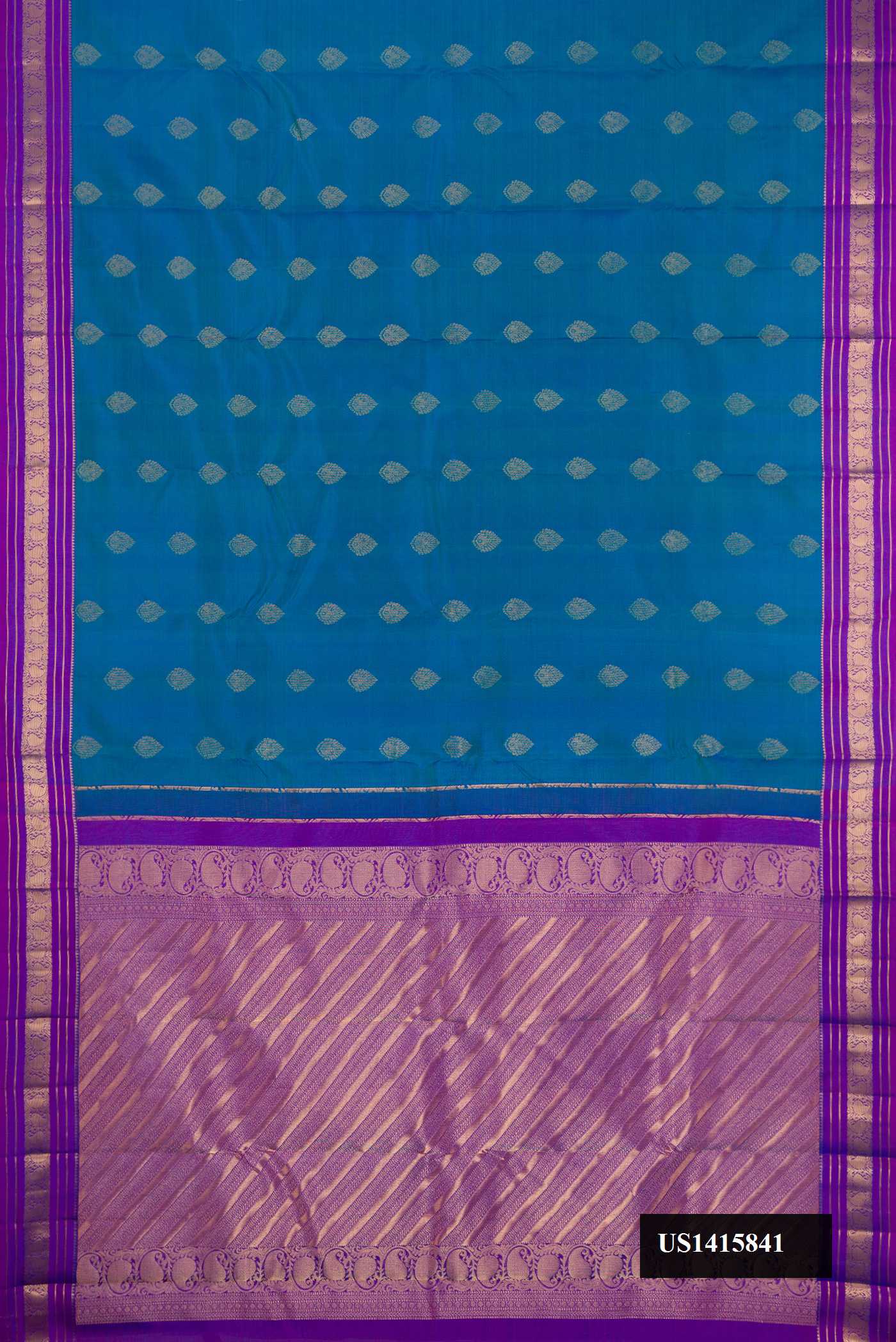 Peacock Blue Dual Tone Kanchipuram Silk Saree with Zari Butta on the body and Zari Border.  displayed on a mannequin