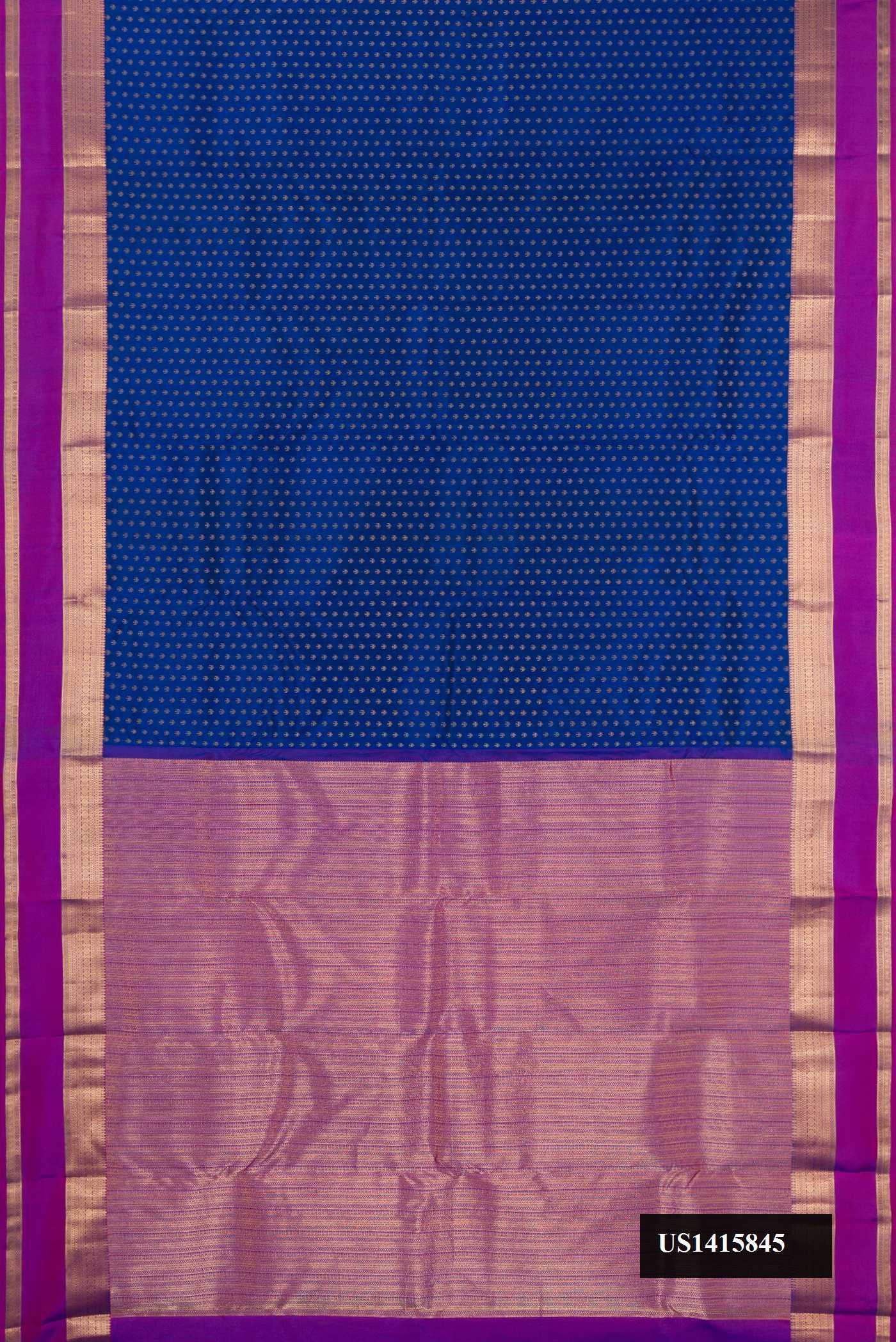 Navy Blue Dual Tone Kanchipuram Silk Saree with Zari Butta on the body and Zari Border.  displayed on a mannequin