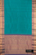 Green Dual Tone Kanchipuram Silk Saree with Zari Butta on the body and Zari Border.  displayed on a mannequin