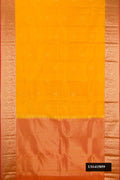 Yellow Dual Tone Kanchipuram Silk Saree with Zari Butta on the body and Zari Border.  displayed on a mannequin