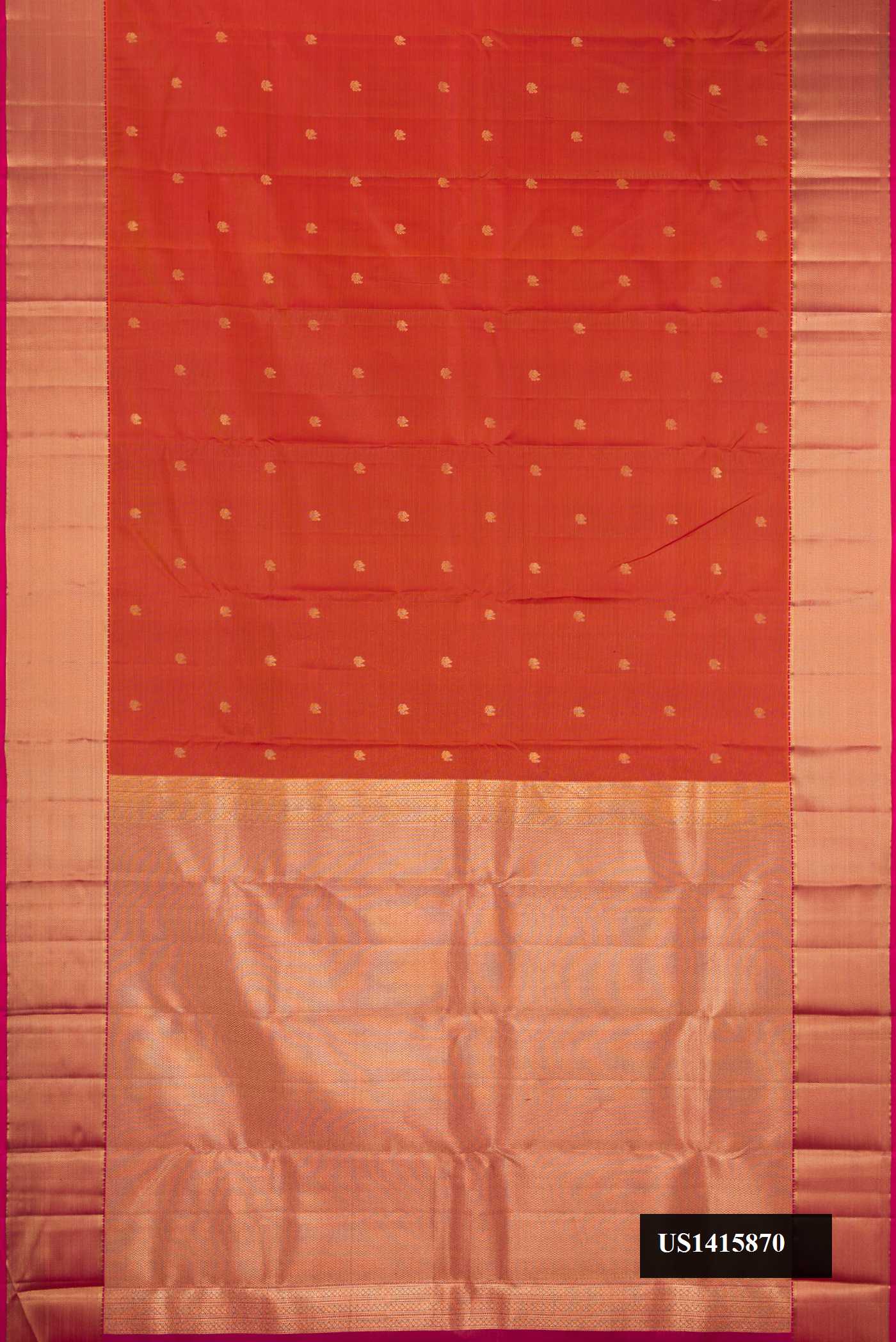 Brick Orange Dual Tone Kanchipuram Silk Saree with Zari Butta on the body and Zari Border.  displayed on a mannequin