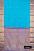 Sky Blue Dual Tone Kanchipuram Silk Saree with Zari Butta on the body and Zari Border.  displayed on a mannequin