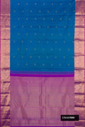 Peacock Blue Dual Tone Kanchipuram Silk Saree with Zari Butta on the body and Zari Border.  displayed on a mannequin