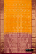 Mustard Dual Tone Kanchipuram Silk Saree with Checked design on the body and Zari Border.  displayed on a mannequin
