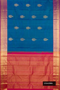Peacock Blue Dual Tone Kanchipuram Silk Saree with Zari Butta on the body and Zari Border.  displayed on a mannequin