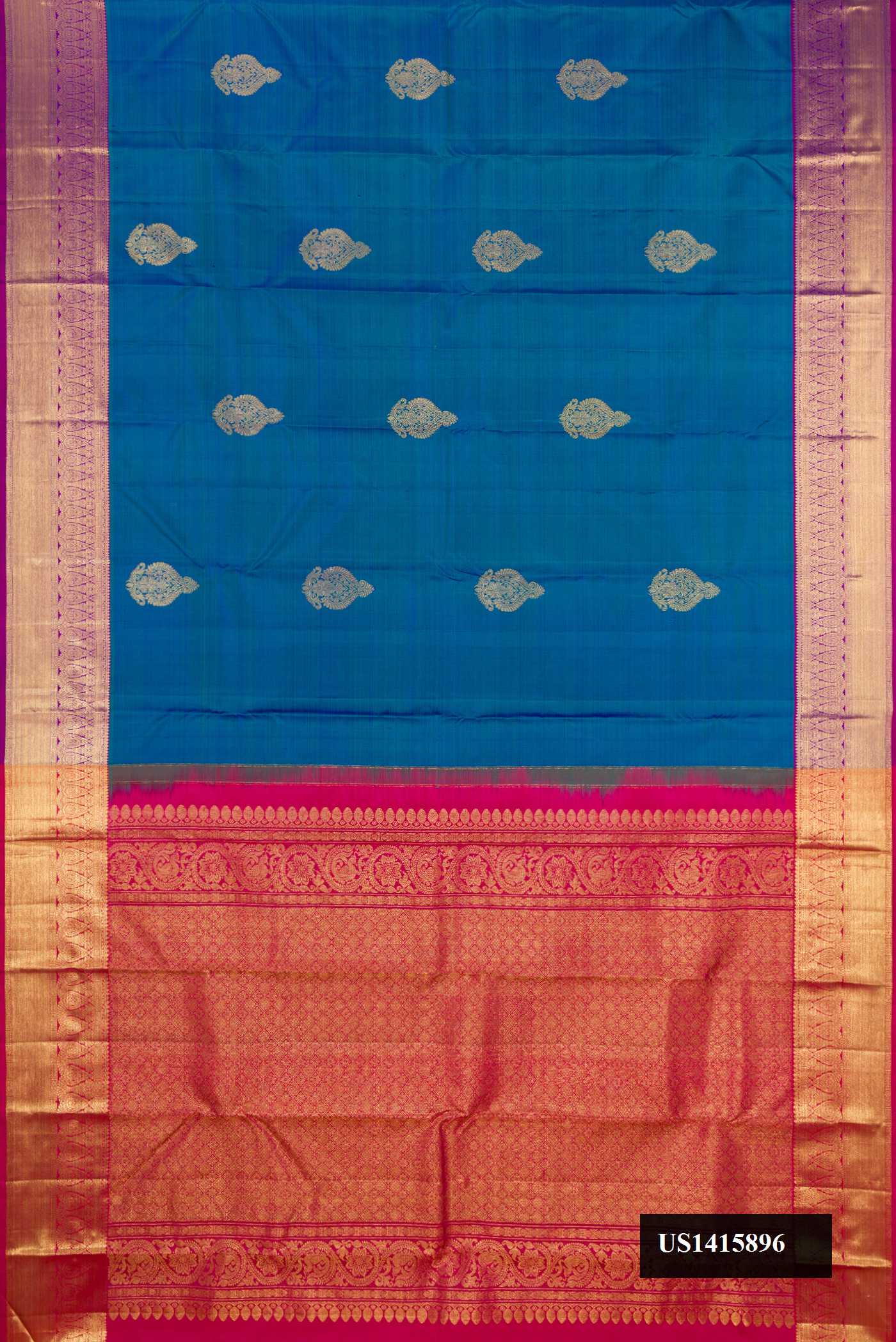 Peacock Blue Dual Tone Kanchipuram Silk Saree with Zari Butta on the body and Zari Border.  displayed on a mannequin