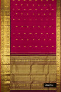 Maroon Dual Tone Kanchipuram Silk Saree with Zari Butta on the body and Zari Border.  displayed on a mannequin