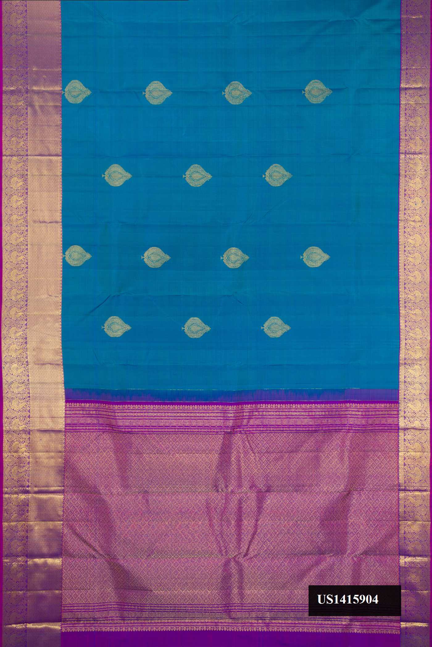 Peacock Blue Dual Tone Kanchipuram Silk Saree with Zari Butta on the body and Zari Border.  displayed on a mannequin