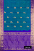Peacock Blue Dual Tone Kanchipuram Silk Saree with Zari Butta on the body and Zari Border.  displayed on a mannequin