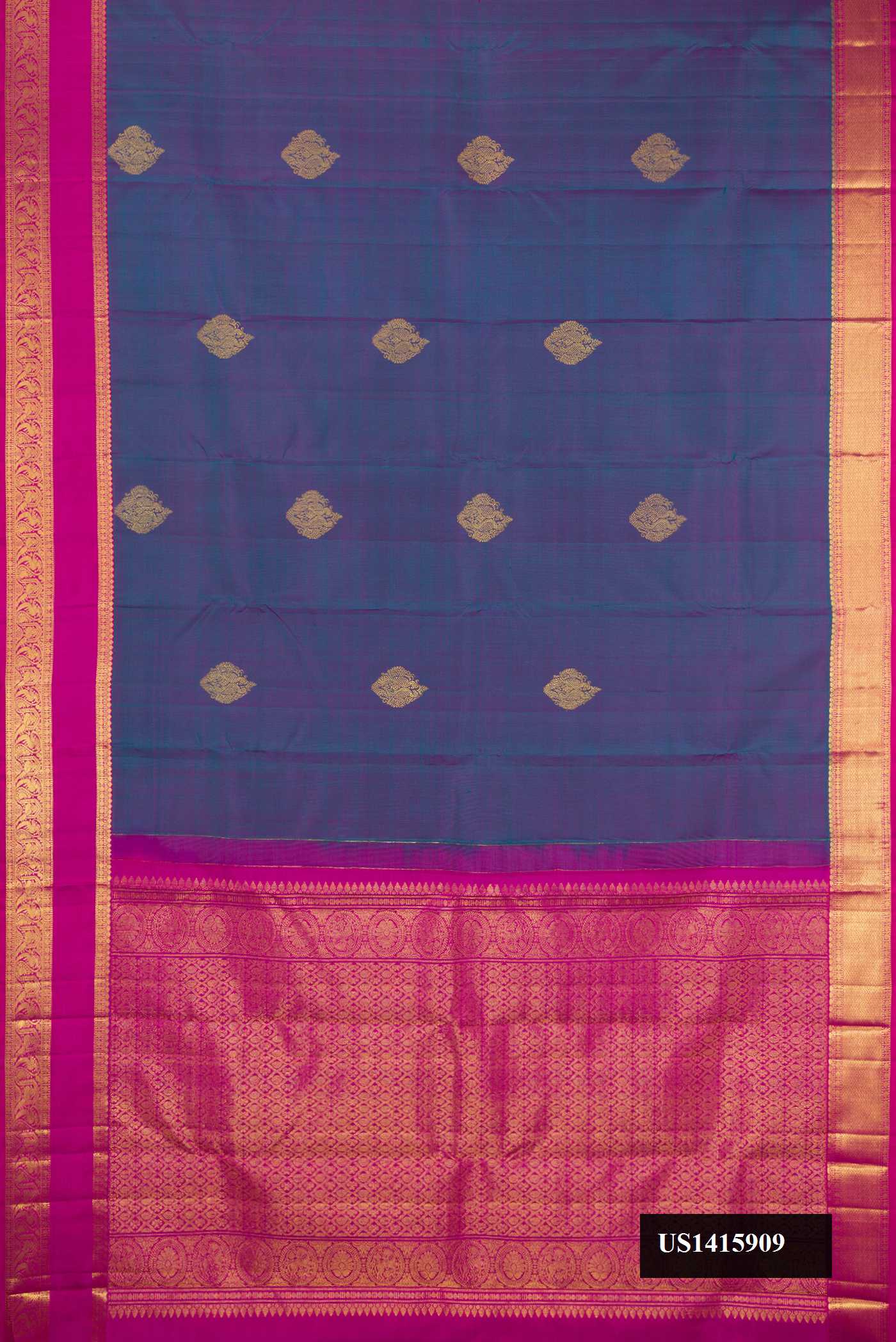 Peacock Blue Dual Tone Kanchipuram Silk Saree with Zari Butta on the body and Zari Border.  displayed on a mannequin