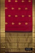 Maroon Dual Tone Kanchipuram Silk Saree with Zari Butta on the body and Zari Border.  displayed on a mannequin