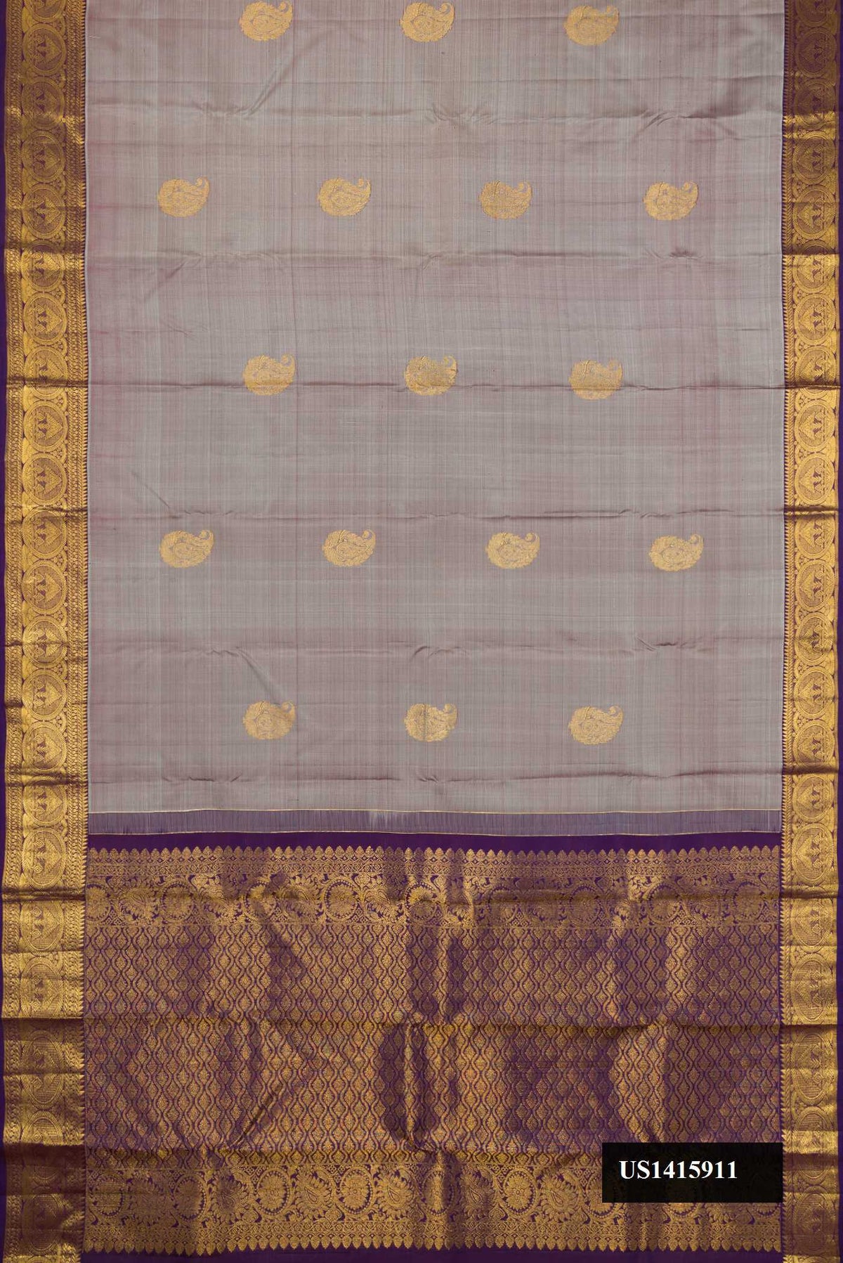 Grey Dual Tone Kanchipuram Silk Saree with Zari Butta on the body and Zari Border.  displayed on a mannequin