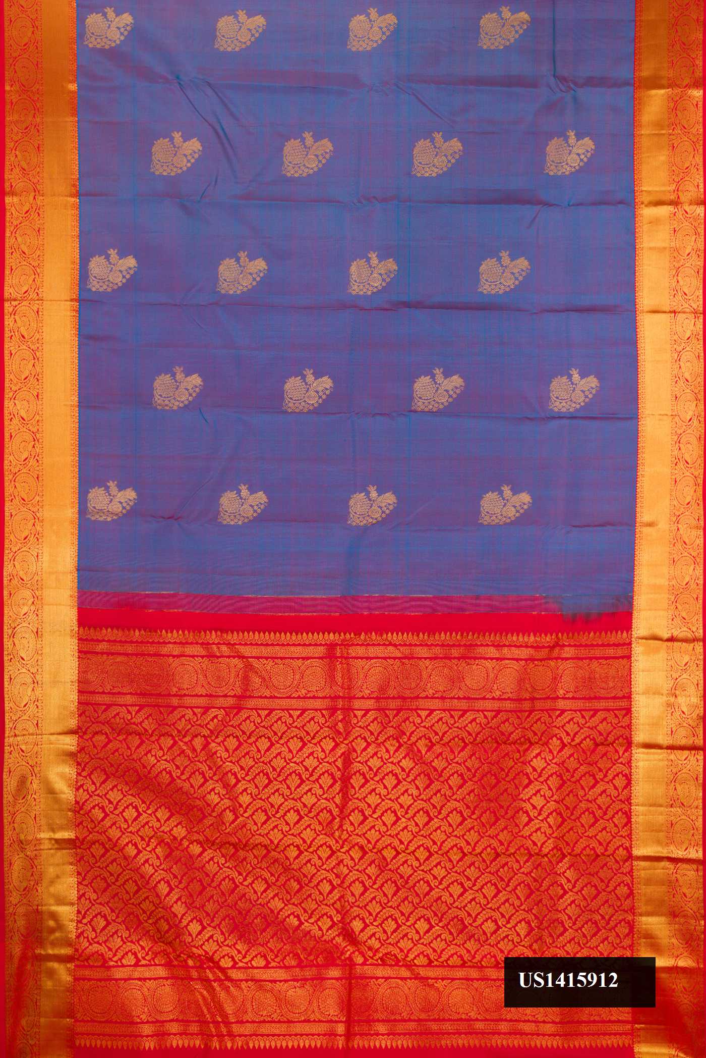 Peacock Blue Dual Tone Kanchipuram Silk Saree with Zari Butta on the body and Zari Border.  displayed on a mannequin