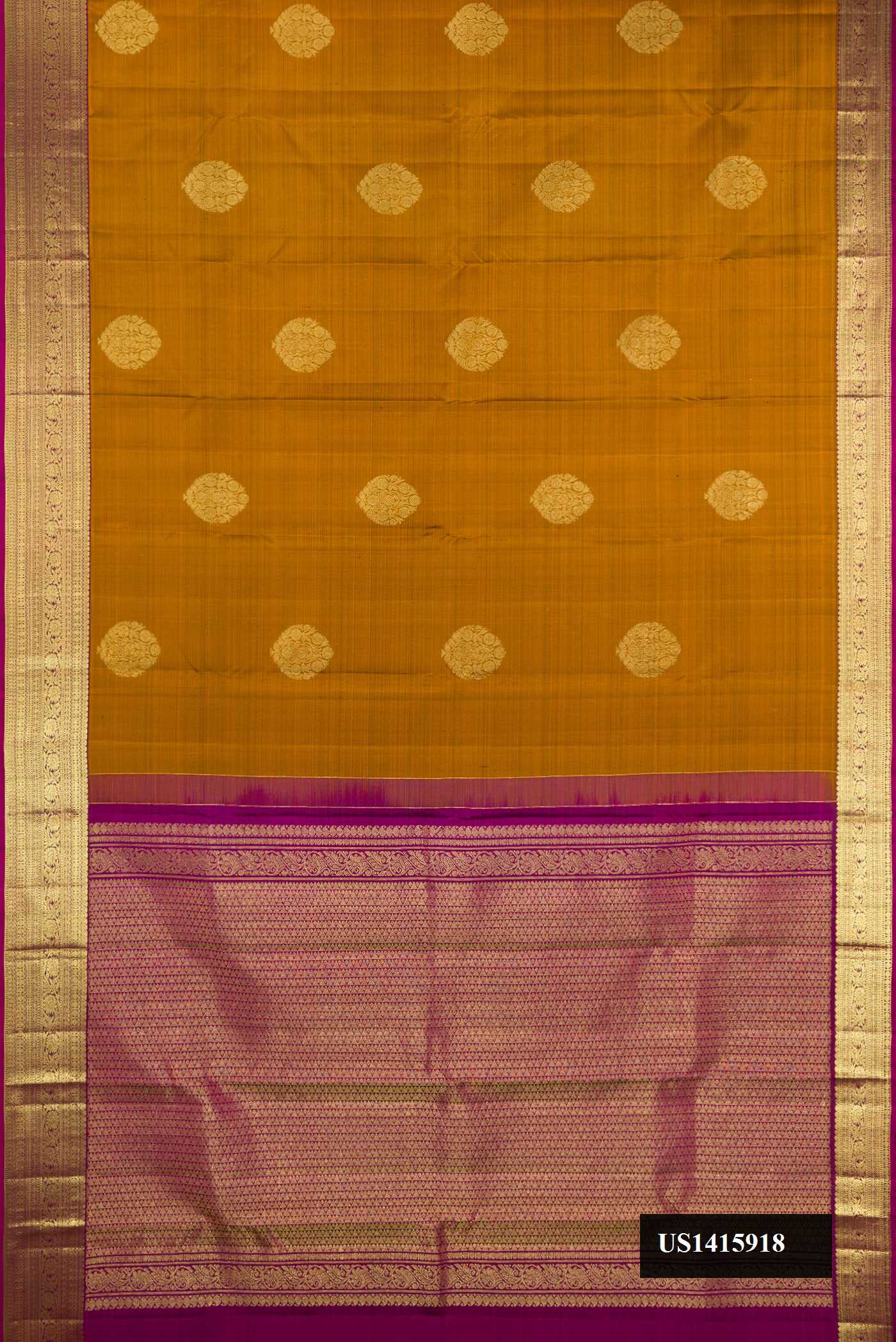 Mustard Dual Tone Kanchipuram Silk Saree with Zari Butta on the body and Zari Border.  displayed on a mannequin
