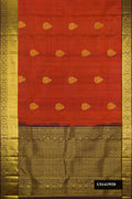 Bronze Dual Tone Kanchipuram Silk Saree with Zari Butta on the body and Zari Border.  displayed on a mannequin