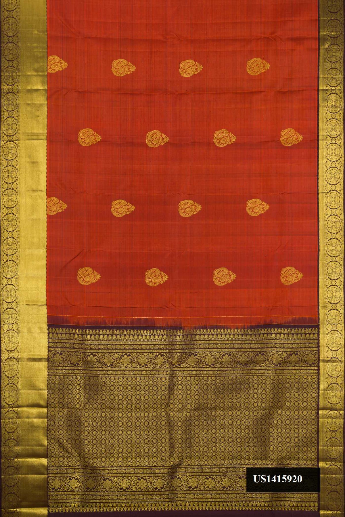 Bronze Dual Tone Kanchipuram Silk Saree with Zari Butta on the body and Zari Border.  displayed on a mannequin