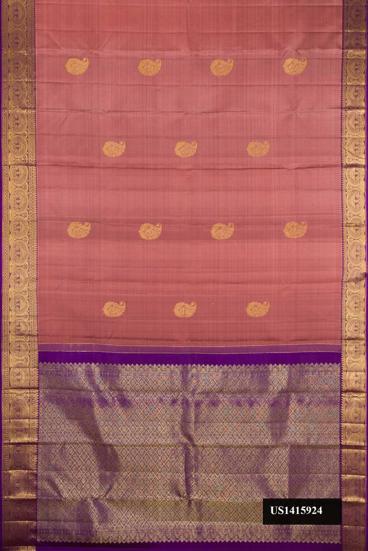Bronze Dual Tone Kanchipuram Silk Saree with Zari Butta on the body and Zari Border.  displayed on a mannequin