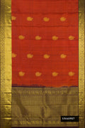 Brick Orange Dual Tone Kanchipuram Silk Saree with Zari Butta on the body and Zari Border.  displayed on a mannequin